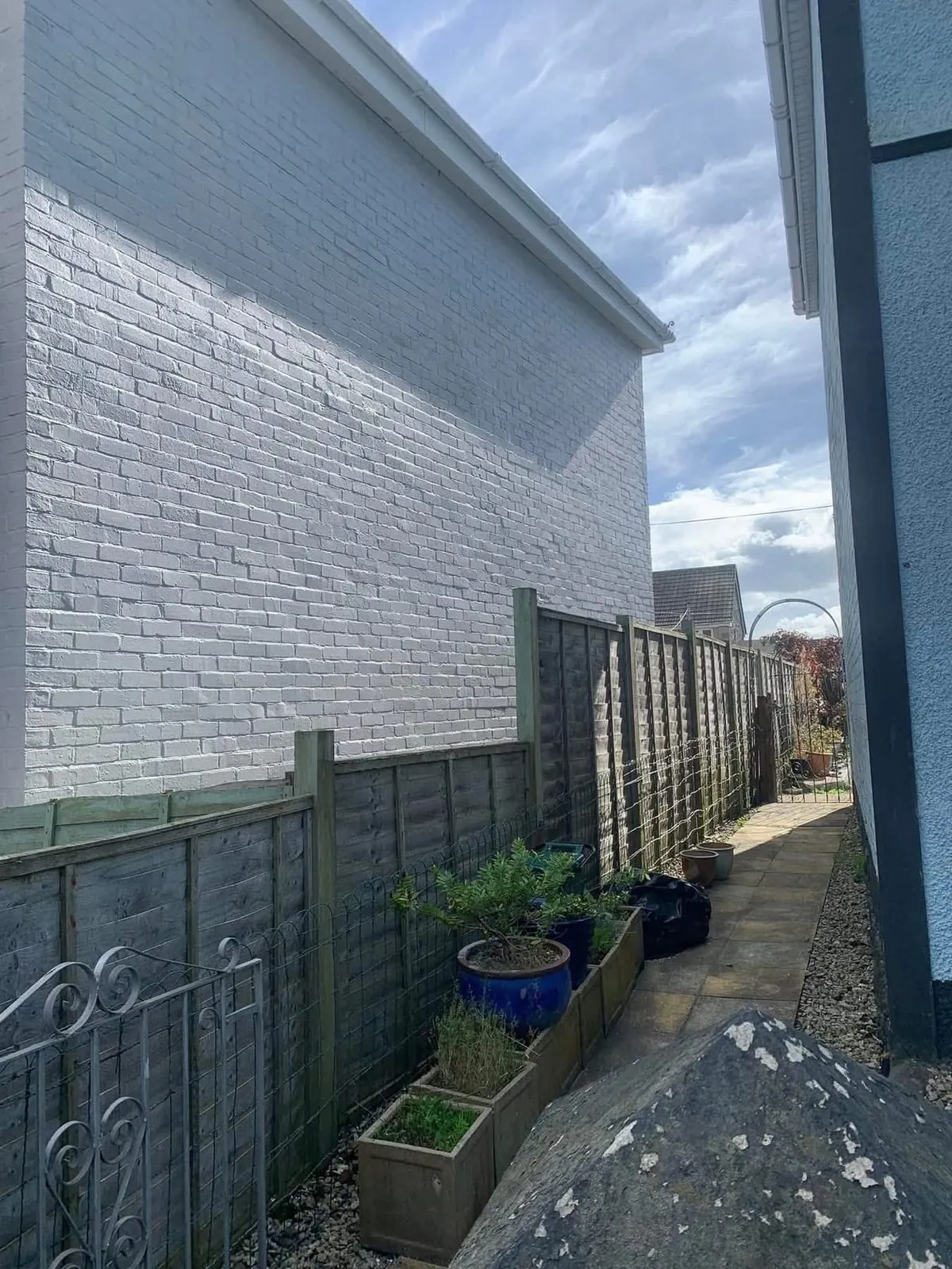 Freshly painted brick wall after preparation and masonry paint in Dartmouth